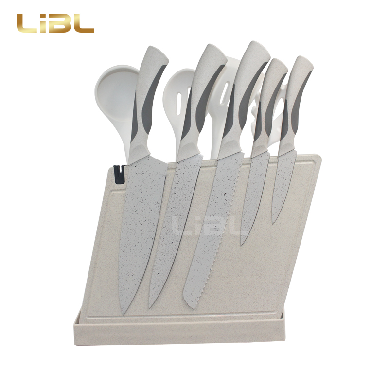 Knife set with cutting board and cooking utensils